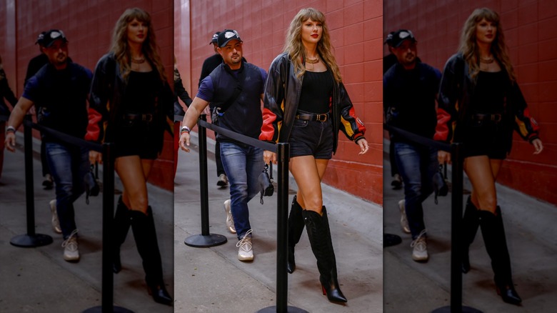 Taylor Swift con botas altas de vaquero sosteniendo un bolso Dior