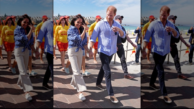 El príncipe Harry y Meghan Markle caminando juntos tomados de la mano.