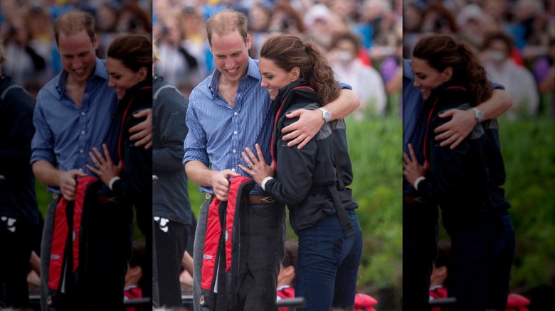 El príncipe William y Kate Middleton se abrazan después de una carrera de botes dragón en su gira por Canadá 2011