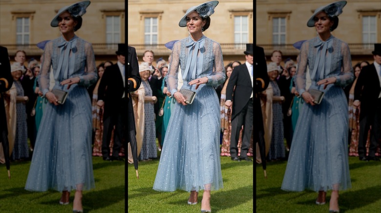 Kate Middleton con un vestido azul polvoriento con mangas transparentes y un sombrero a juego en la fiesta de coronación en el jardín del rey Carlos.