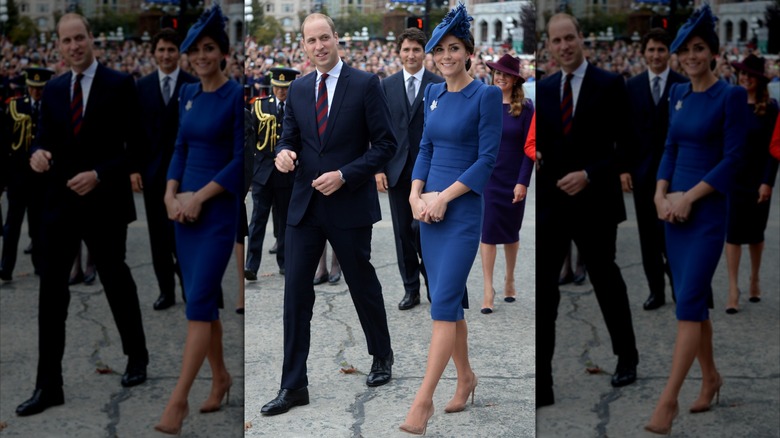 Kate Middleton con un vestido azul oscuro ceñido y un sombrero a juego y el Príncipe William con un traje en un evento de bienvenida a su gira real por Canadá en 2016.
