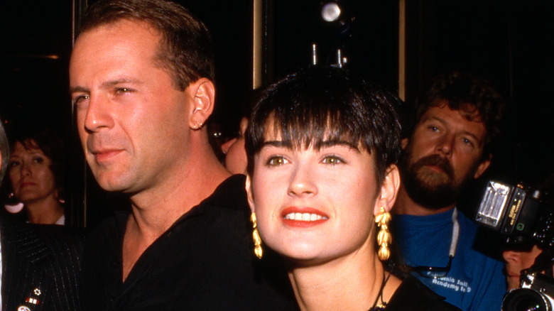Bruce Willis y Demi Moore en los años 80 vistiendo de negro